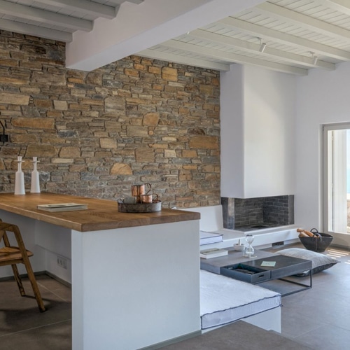 villa with stone wall details tinos