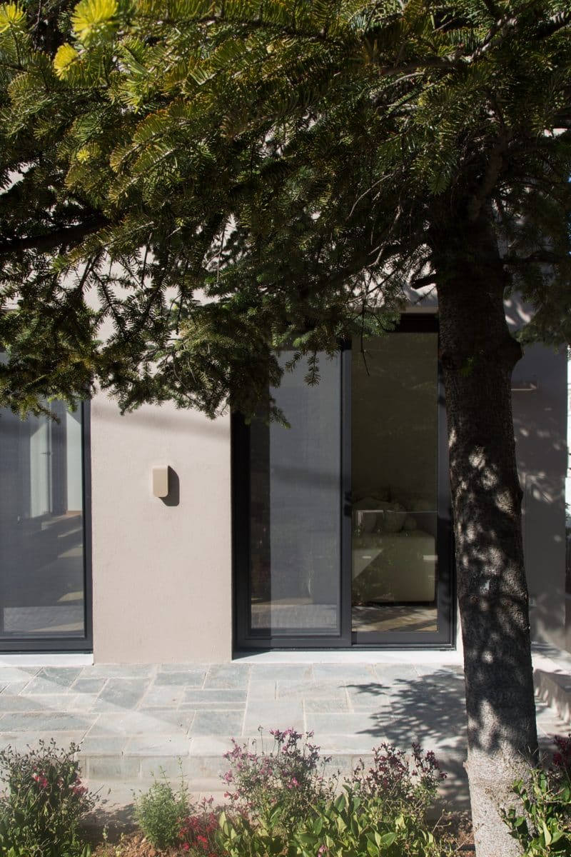 villa in kefalari neutral tones pine tree garden